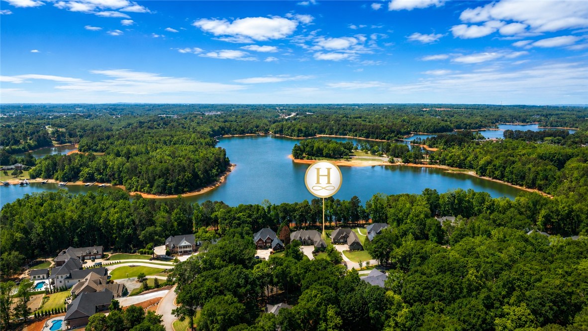114 Willowbend Drive Anderson, SC 29621 - Photo 47 of 50 This elevated view captures a serene lakeside community nestled among lush green forests.
