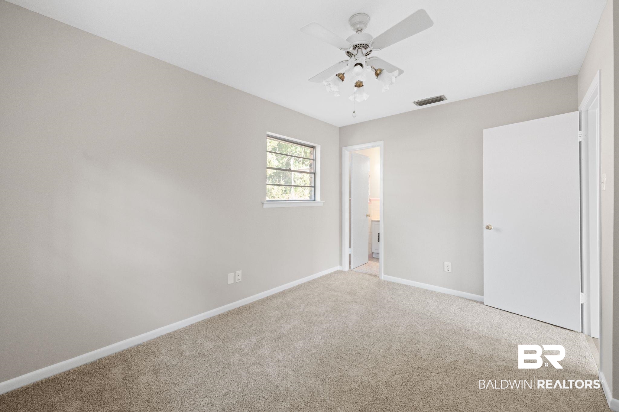 909 Caroline Avenue Daphne, AL 36526 - Photo 33 of 46 Carpeted spare room with ceiling fan
