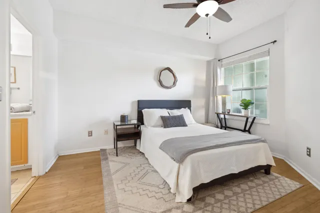 a bedroom with a bed and window