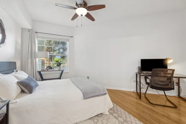 a bedroom with a bed and a chair