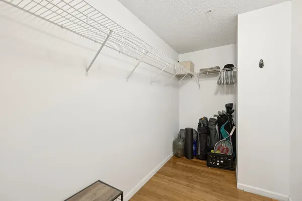a view of a room with rack and wooden floor