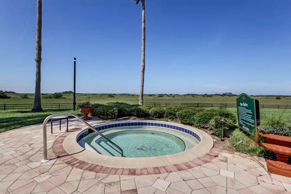 a view of a swimming pool with a yard