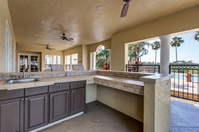 a kitchen with granite countertop a stove and a sink