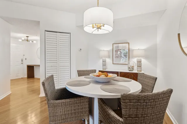 a view of a dining room with furniture and chandelier