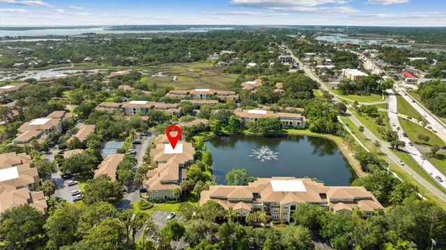 an aerial view of residential houses with outdoor space