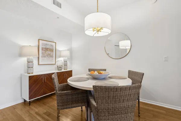 a dining room with furniture and window