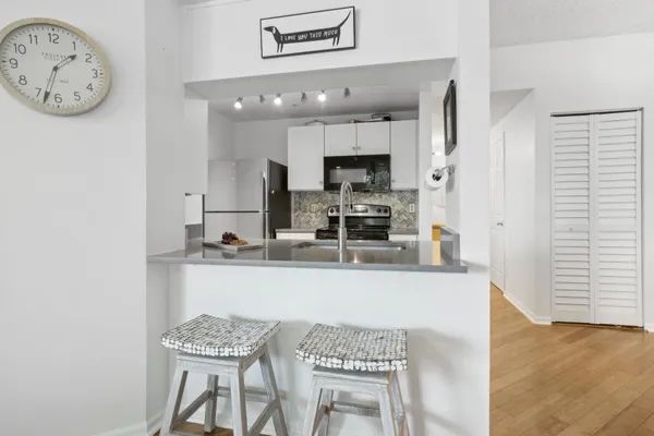 a view of kitchen with cabinets and outdoor space