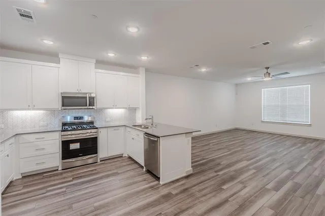 a view of a room with wooden floor entryway