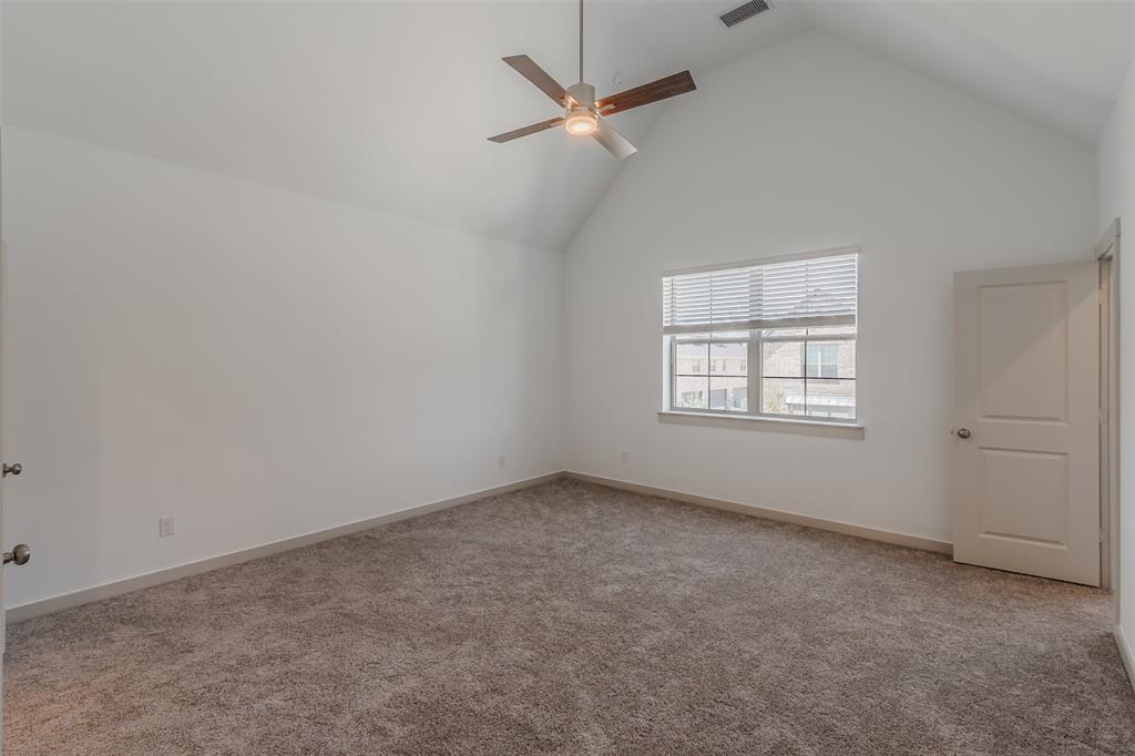 682 Vista Oaks Road Lewisville, TX 75067 - Photo 17 of 38 an empty room with a window and a fan
