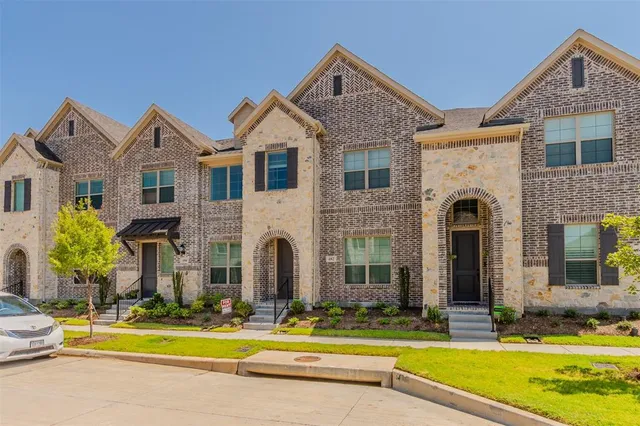 a front view of a house with swimming pool and porch with furniture