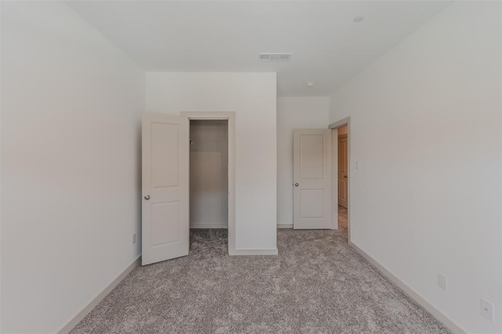 682 Vista Oaks Road Lewisville, TX 75067 - Photo 23 of 38 a view of an empty room and closet