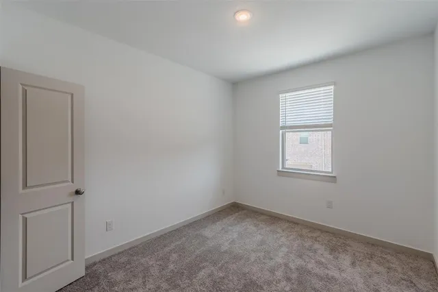 a view of an empty room and closet