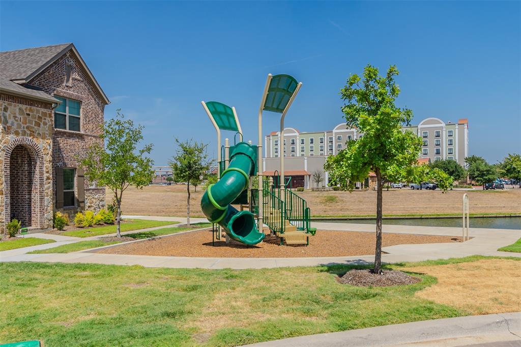 682 Vista Oaks Road Lewisville, TX 75067 - Photo 32 of 38 a view of a house with entertaining space and potted plants