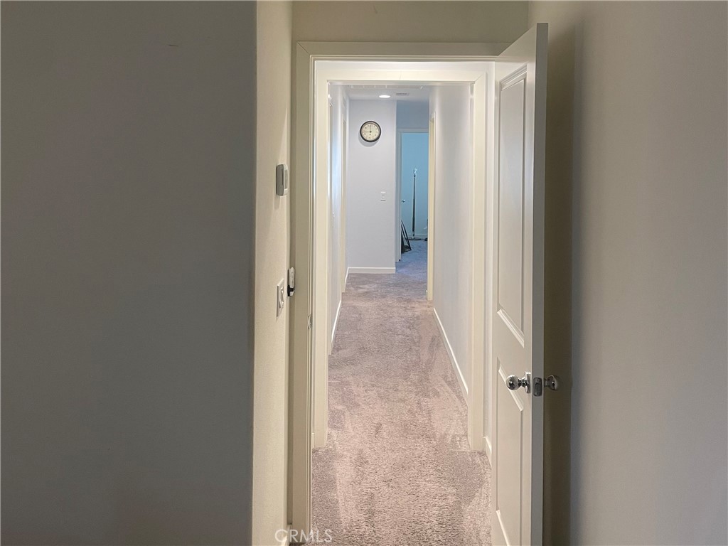 27393 Red Rock Road Moreno Valley, CA 92555 - Photo 13 of 31 a view of a livingroom from a hallway