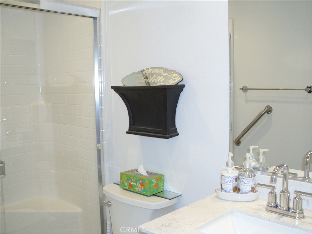 27393 Red Rock Road Moreno Valley, CA 92555 - Photo 7 of 31 a bathroom with a sink and a mirror