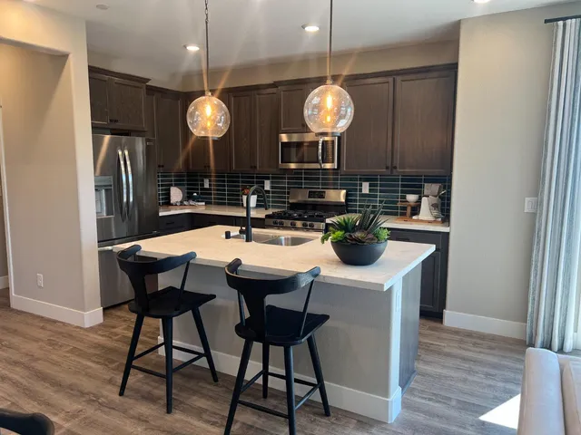 a kitchen with a table and chairs in it