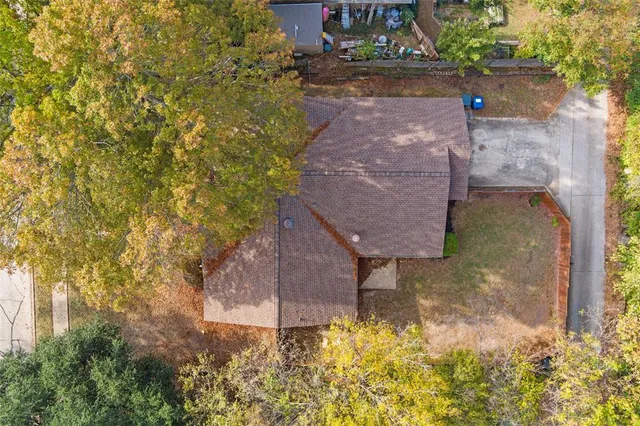 a view of a backyard with sitting area