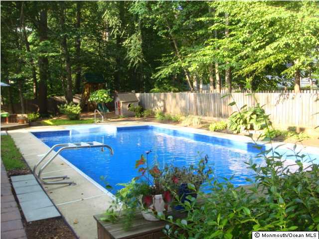 26 Tall Tree Road Middletown, NJ 07748 - Photo 2 of 3 a view of a swimming pool with an outdoor space