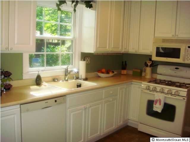 26 Tall Tree Road Middletown, NJ 07748 - Photo 3 of 3 a kitchen with appliances cabinets and a sink
