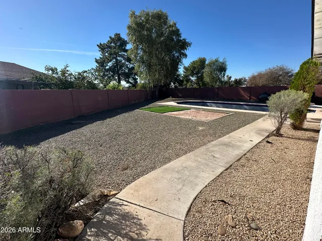 a view of swimming pool with a yard