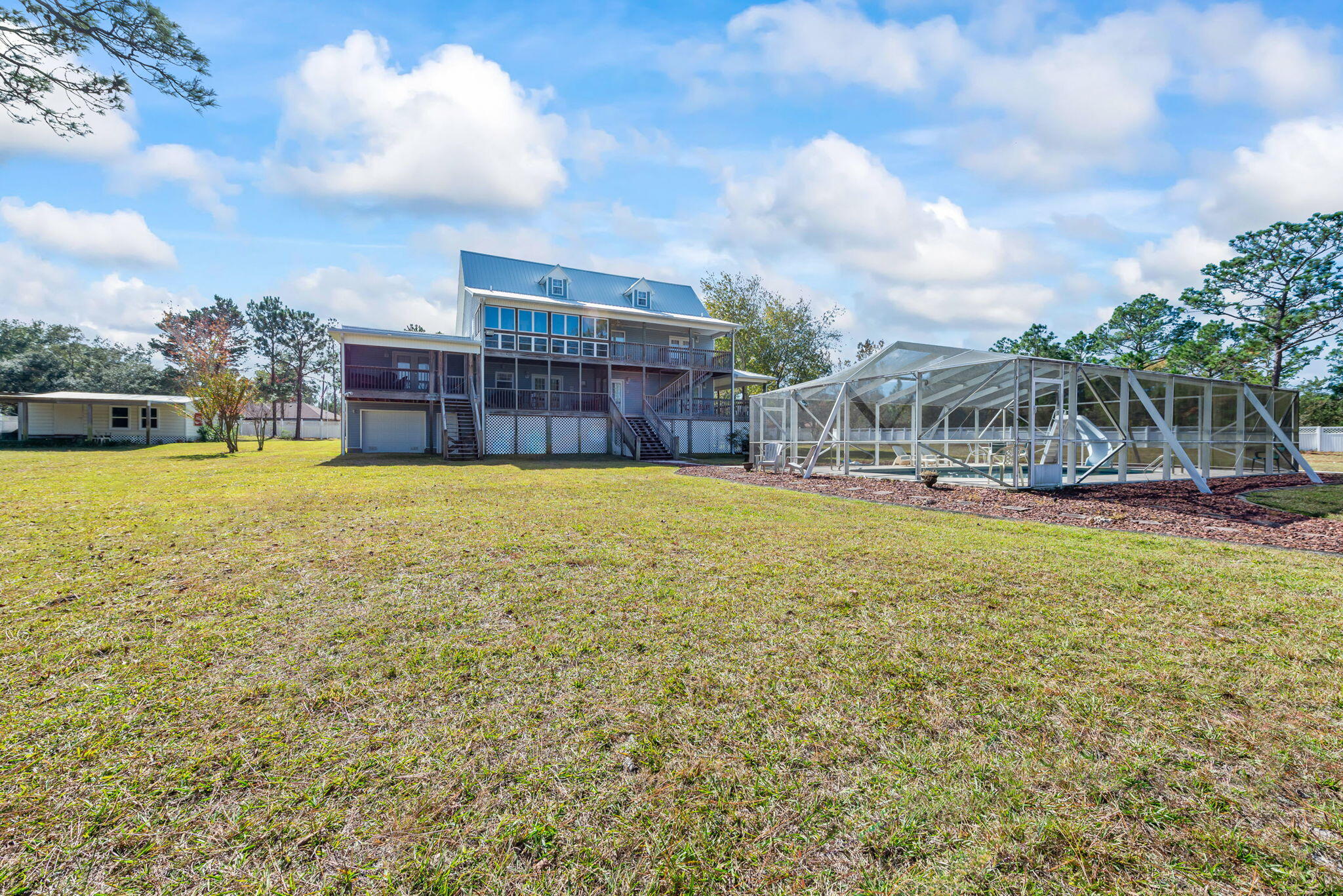 9524 Bone Bluff Drive Navarre, FL 32566 - Photo 17 of 68 a view of swimming pool with outdoor seating and yard in back
