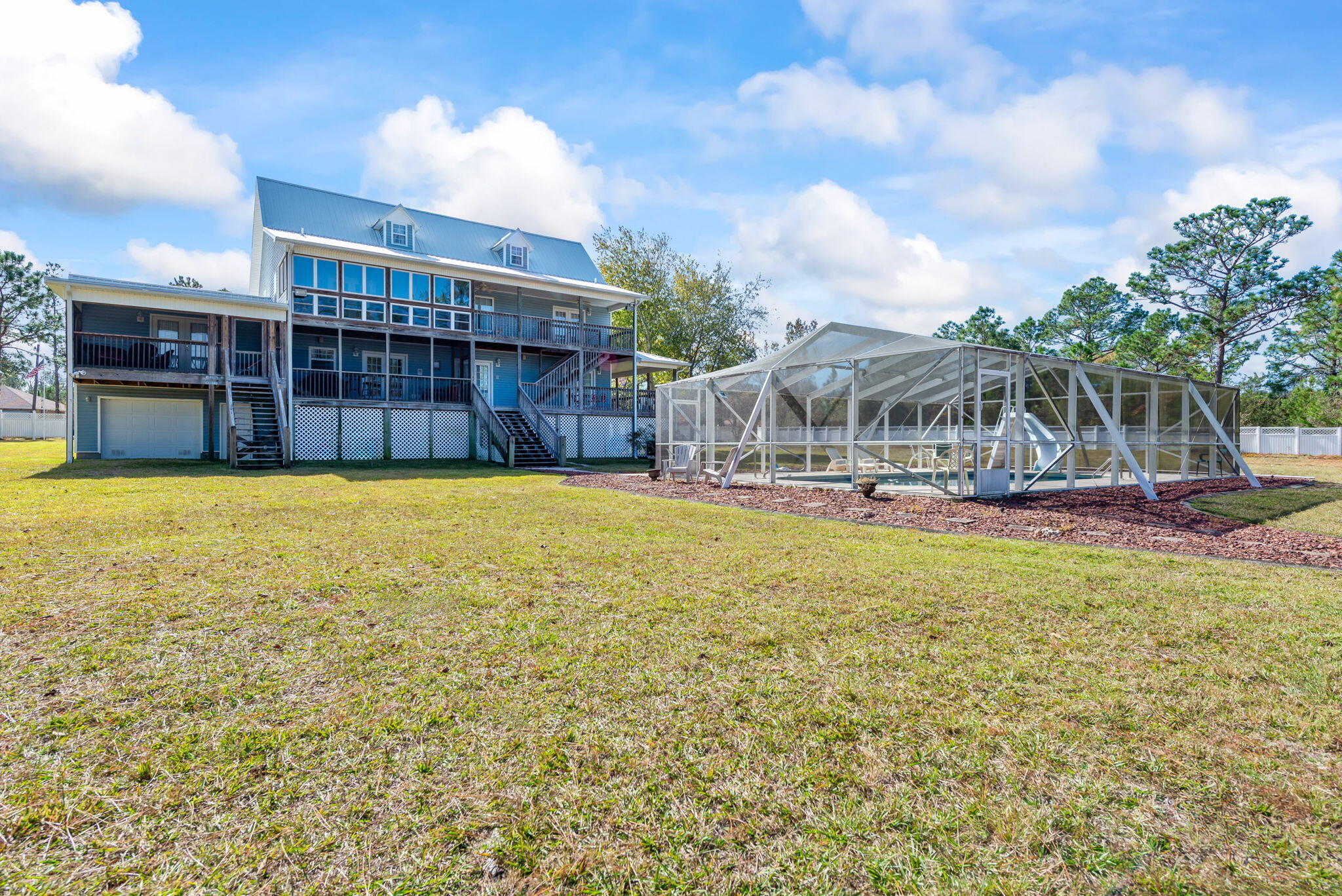 9524 Bone Bluff Drive Navarre, FL 32566 - Photo 18 of 68 a view of a house with swimming pool and sitting area