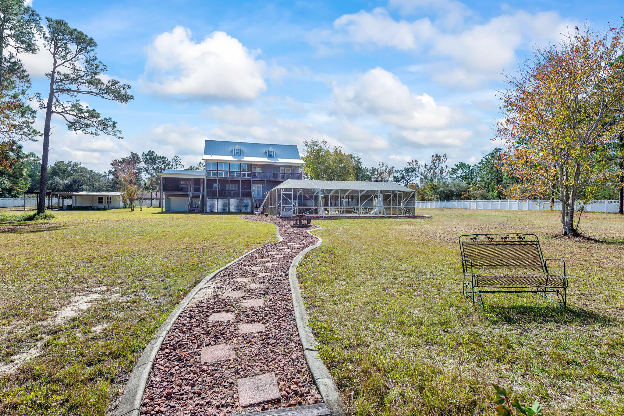 9524 Bone Bluff Drive Navarre, FL 32566 - Photo 19 of 68 a view of a swimming pool with a yard