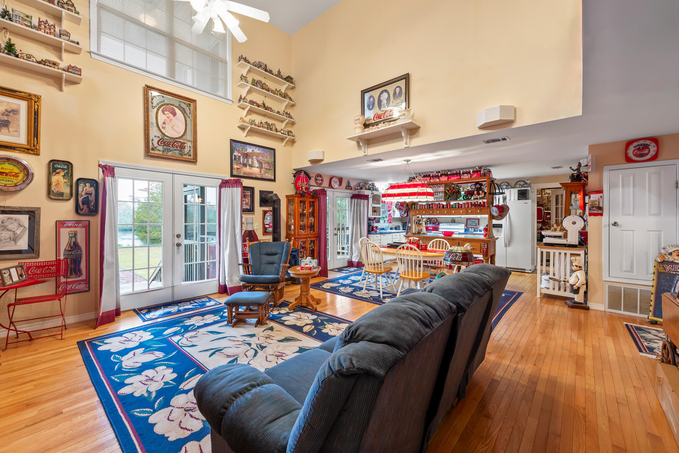 9524 Bone Bluff Drive Navarre, FL 32566 - Photo 23 of 68 a living room filled with furniture and a kitchen view