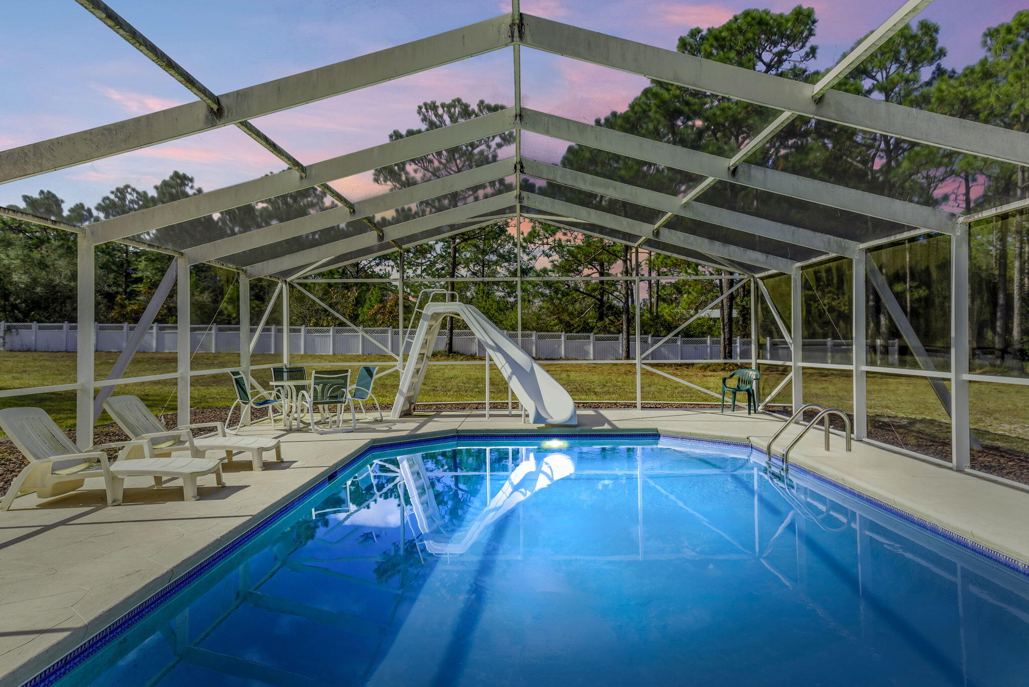 9524 Bone Bluff Drive Navarre, FL 32566 - Photo 3 of 68 a view of a swimming pool with a porch