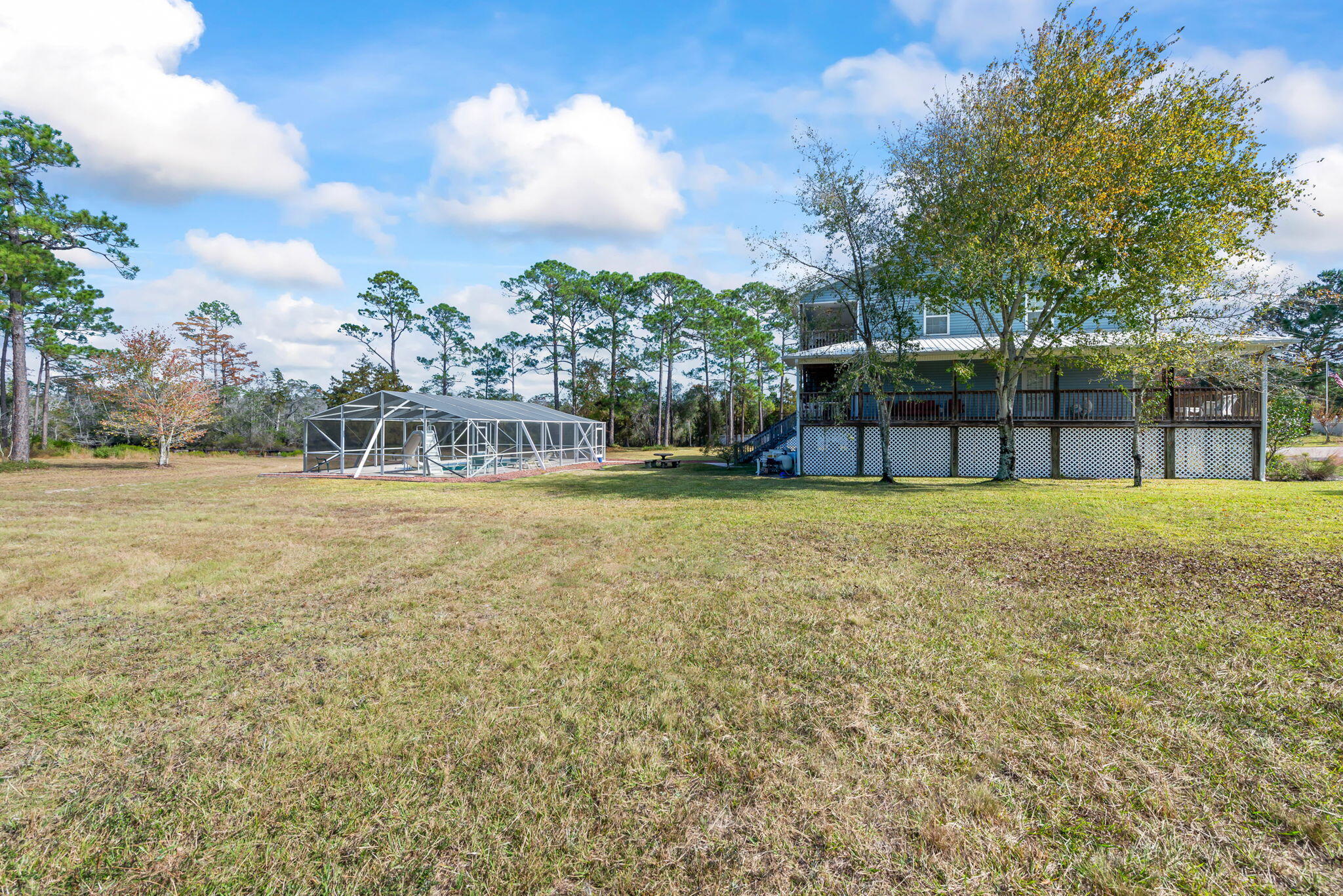 9524 Bone Bluff Drive Navarre, FL 32566 - Photo 60 of 68 a view of house with swimming pool and green space