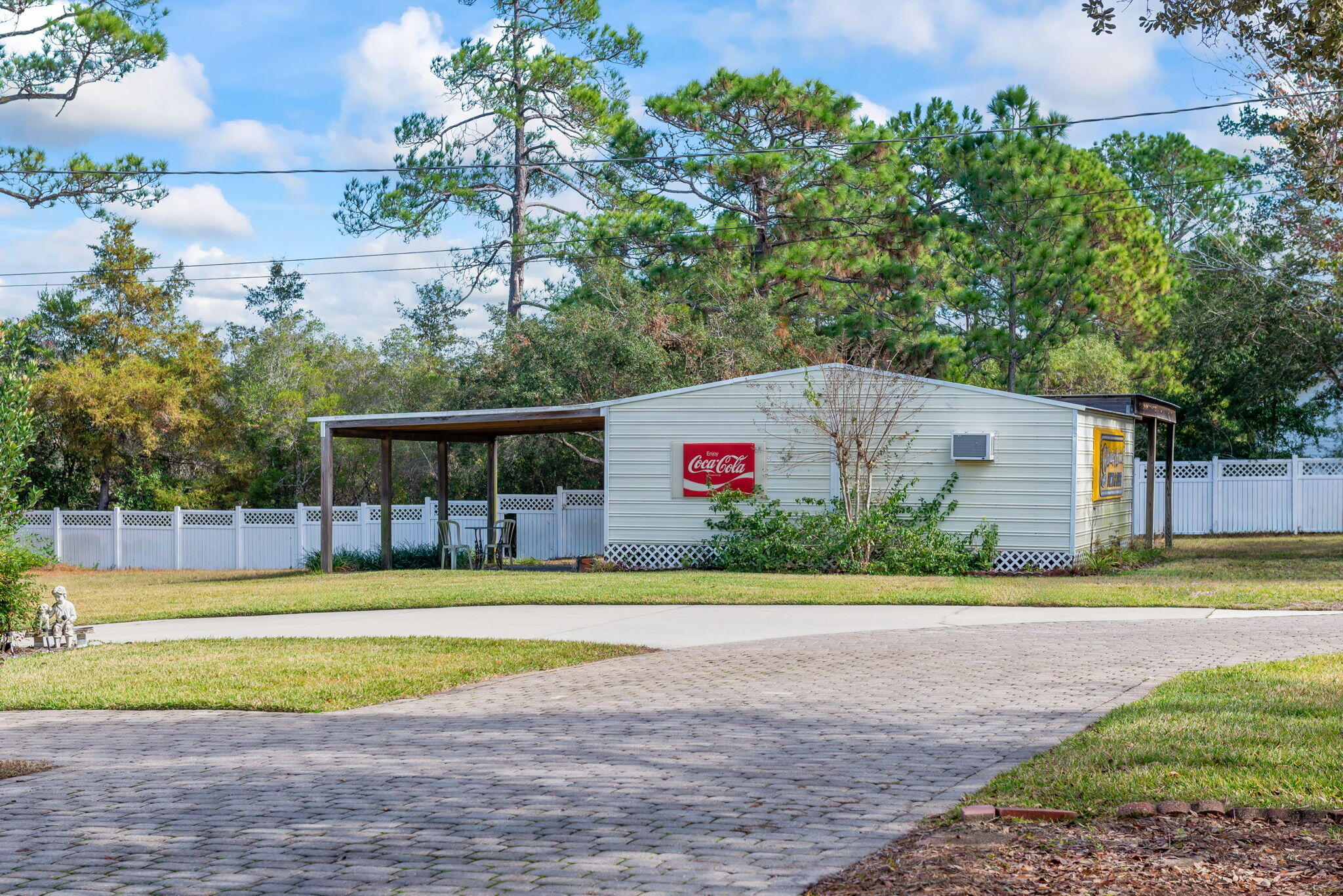 9524 Bone Bluff Drive Navarre, FL 32566 - Photo 66 of 68 a front view of a house with a yard and trees
