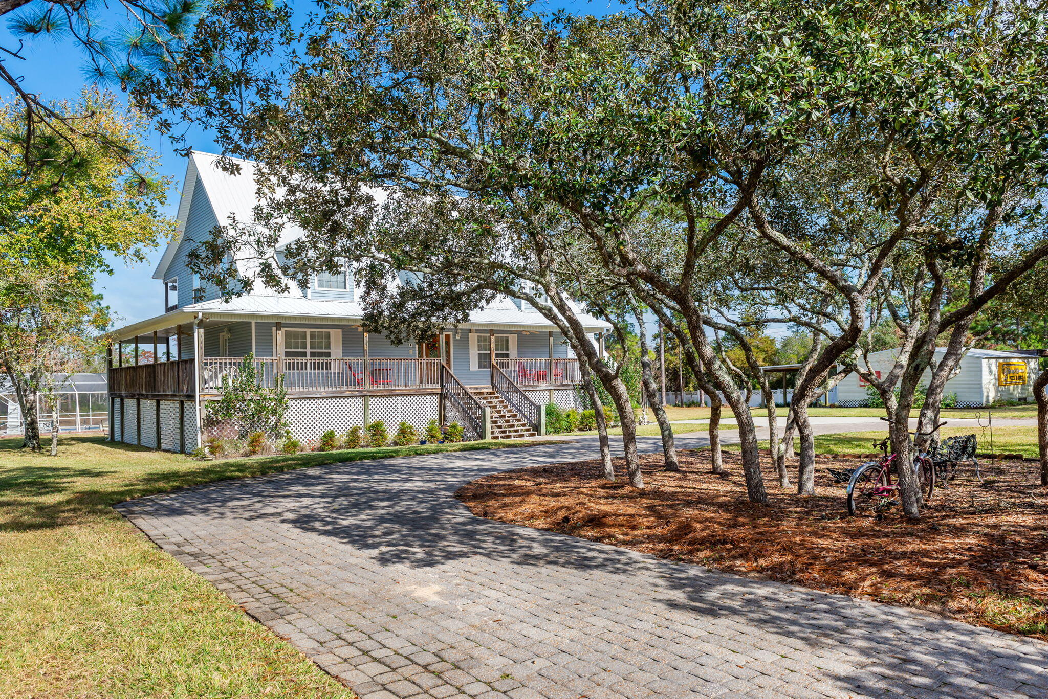 9524 Bone Bluff Drive Navarre, FL 32566 - Photo 10 of 68 a front view of a house with a yard
