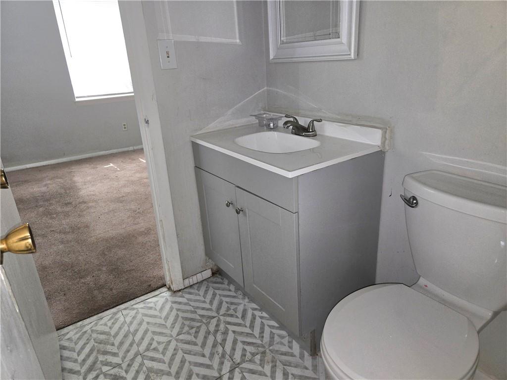 4701 Flat Shoals Road, Unit 67D Union City, GA 30291 - Photo 11 of 13 a bathroom with a toilet and a sink