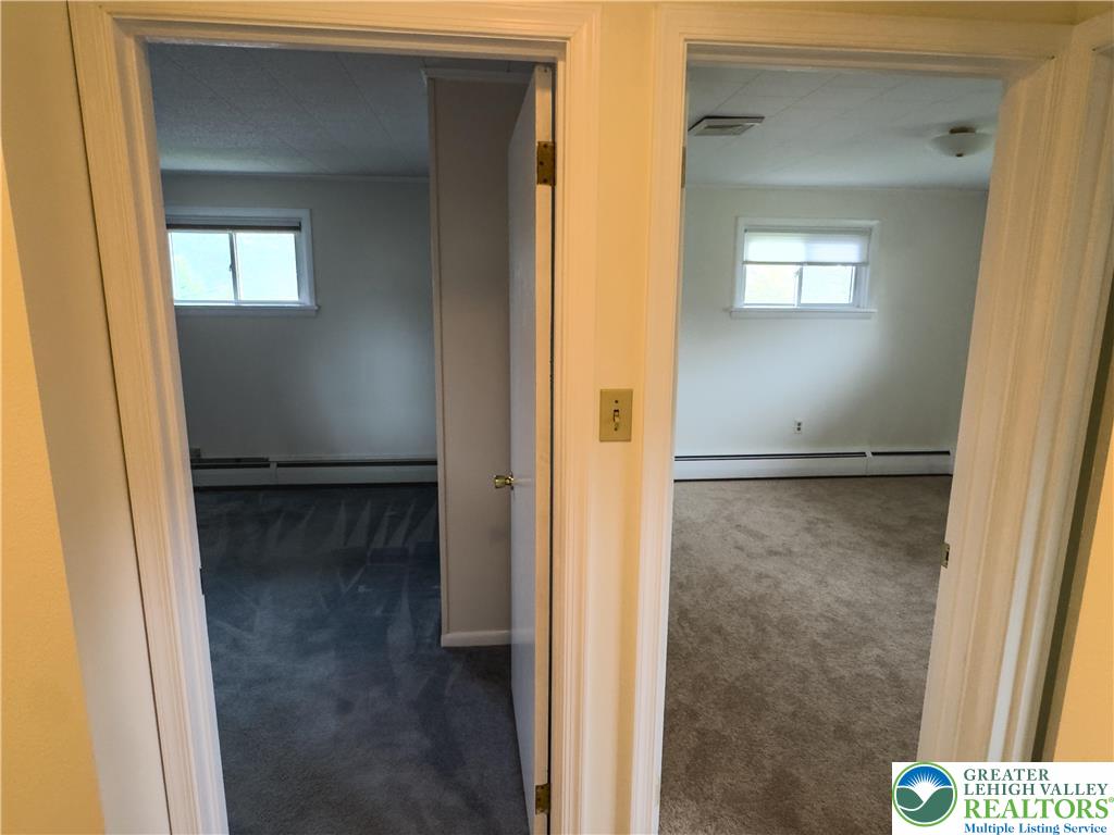 13 Craig Road Lehighton, PA 18235 - Photo 27 of 39 These inviting bedrooms feature soft carpeting and ample natural light, creating serene private spaces.