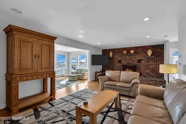 a kitchen with a sink dining table and chairs