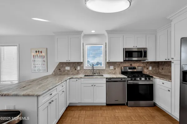 a kitchen with a sink and cabinets
