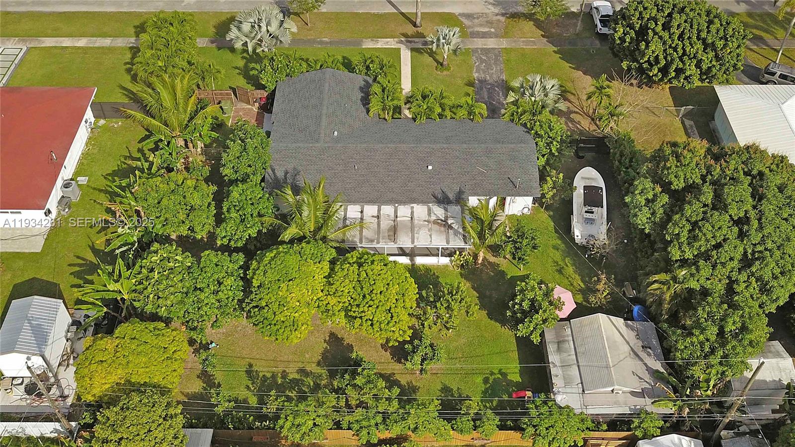 514 Northwest 21st Street Homestead, FL 33030 - Photo 11 of 45 an aerial view of a residential apartment building with a yard and garden space