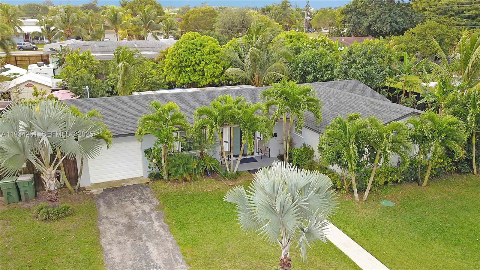 514 Northwest 21st Street Homestead, FL 33030 - Photo 2 of 45 a view of a swimming pool with a patio