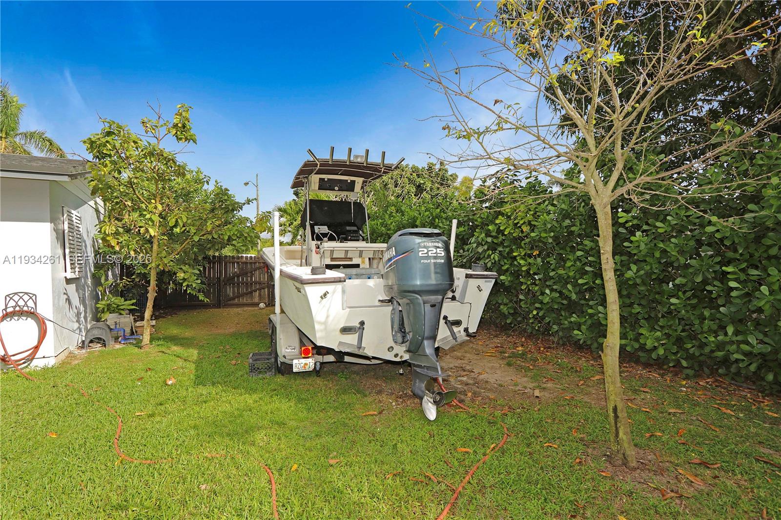 514 Northwest 21st Street Homestead, FL 33030 - Photo 27 of 45 a view of a chairs and table in backyard