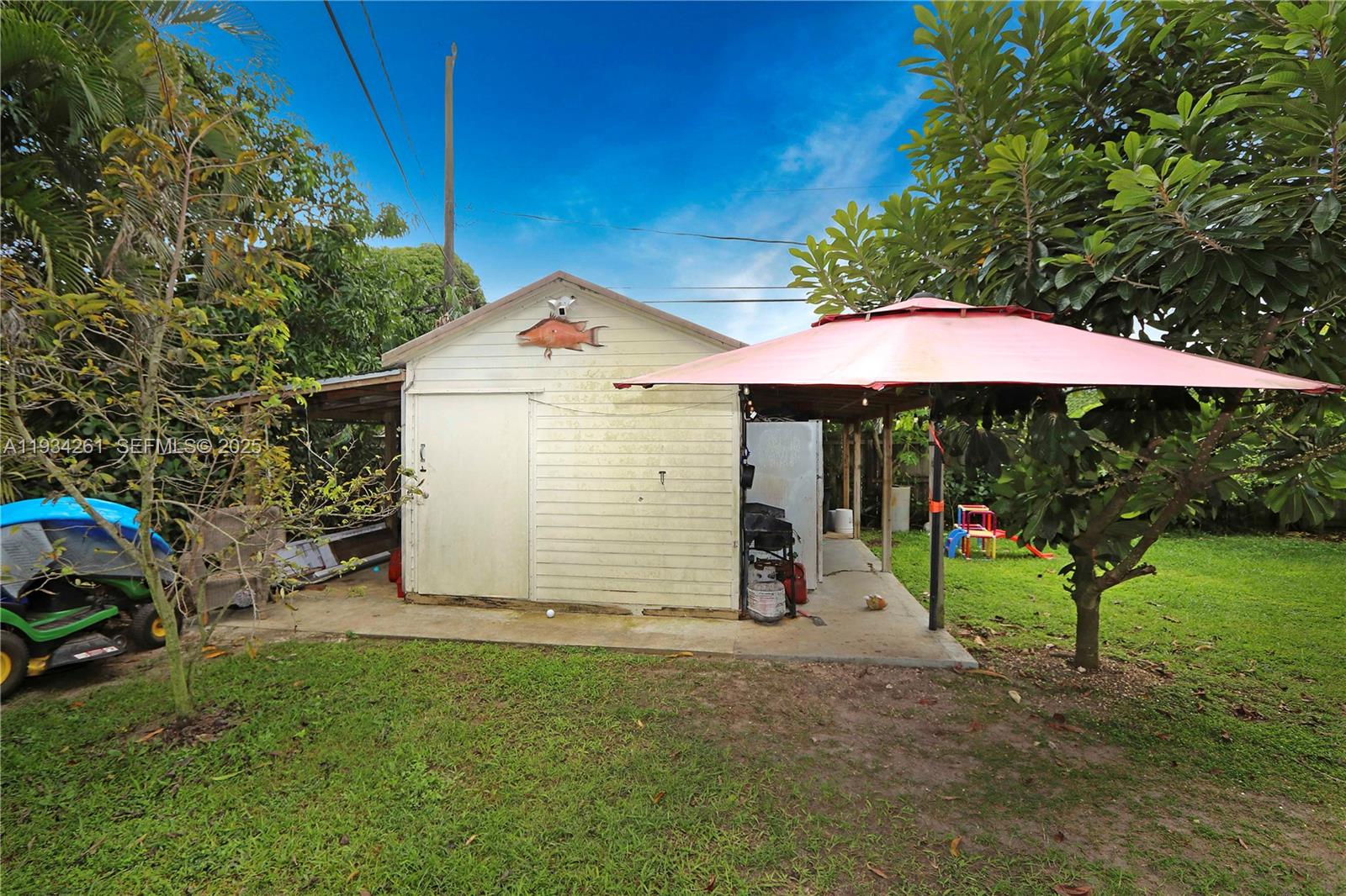 514 Northwest 21st Street Homestead, FL 33030 - Photo 28 of 45 a view of a house with a yard and sitting area