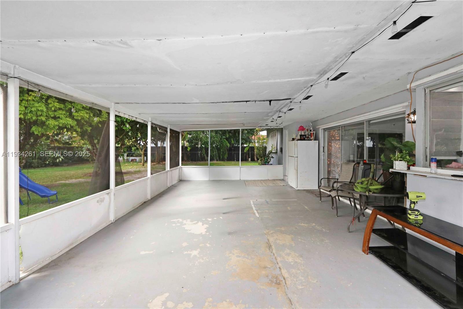 514 Northwest 21st Street Homestead, FL 33030 - Photo 29 of 45 a view of front door with outdoor seating