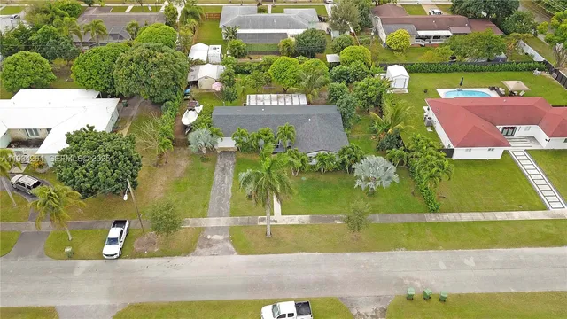 an aerial view of residential houses with outdoor space