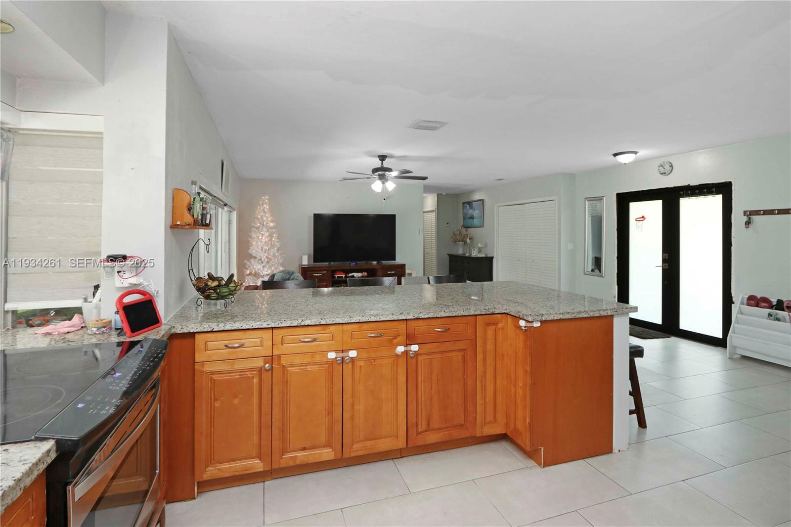 514 Northwest 21st Street Homestead, FL 33030 - Photo 41 of 45 a large kitchen with stainless steel appliances granite countertop a sink and a microwave