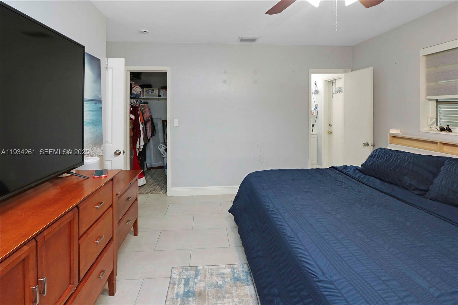 514 Northwest 21st Street Homestead, FL 33030 - Photo 43 of 45 a bedroom with a bed and a walk in closet