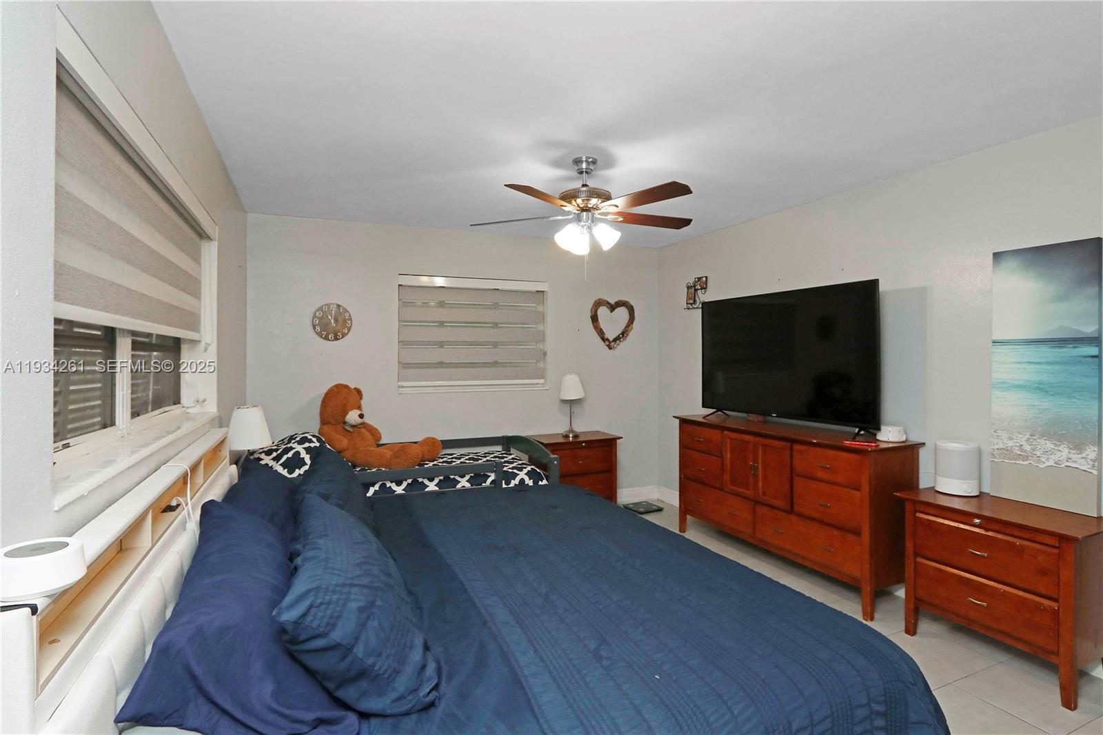 514 Northwest 21st Street Homestead, FL 33030 - Photo 45 of 45 a living room with furniture and a flat screen tv