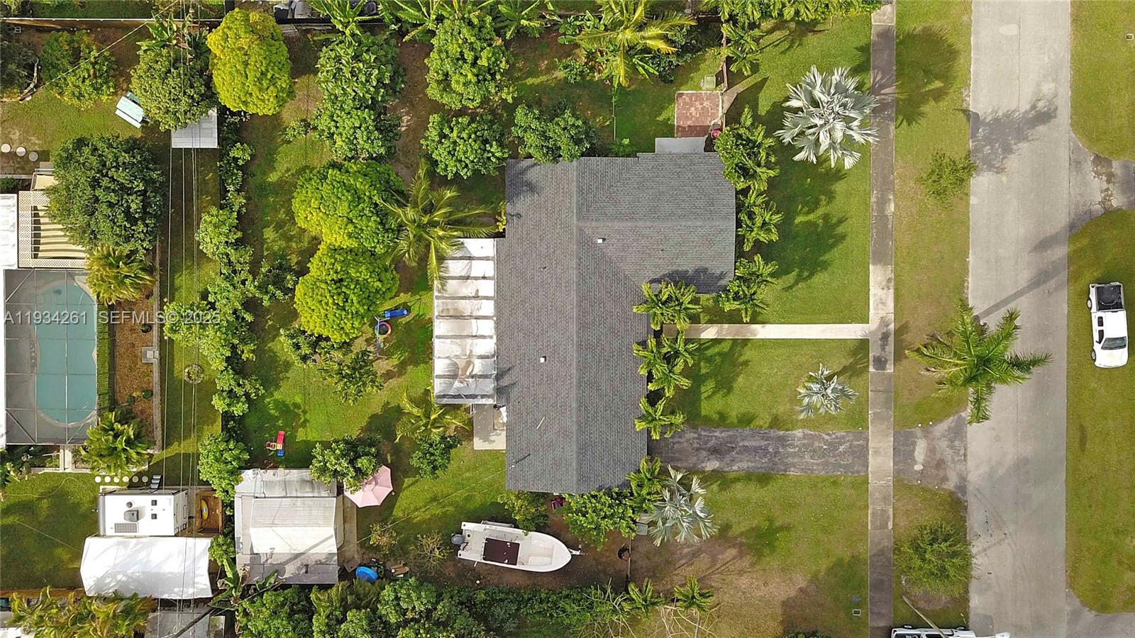 514 Northwest 21st Street Homestead, FL 33030 - Photo 9 of 45 view of backyard with plants and outdoor seating