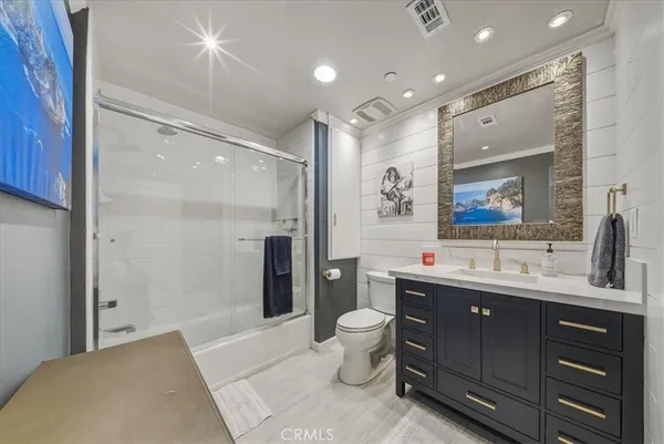 a spacious bedroom with a bed and walk in closet