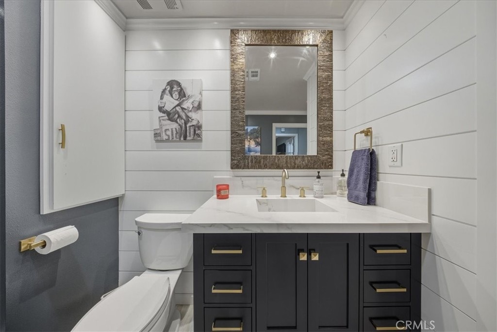 1901 Victoria Avenue, Unit 116 Oxnard, CA 93035 - Photo 13 of 31 a bathroom with a sink vanity and toilet