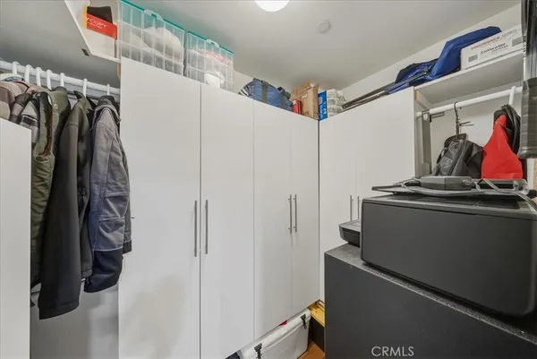a view of a bedroom with washer and dryer