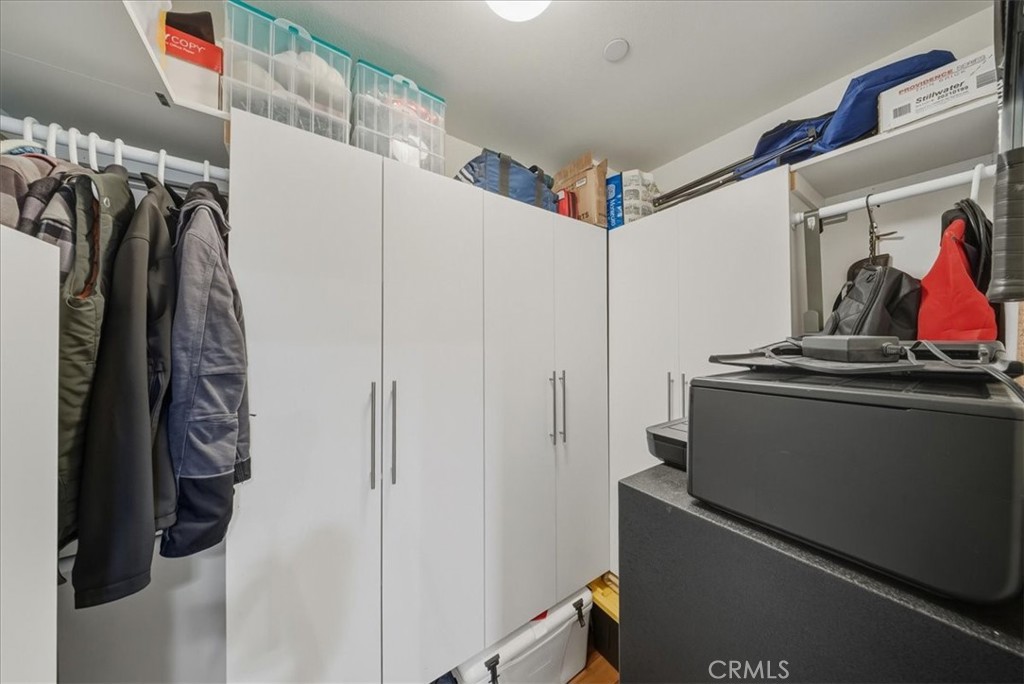1901 Victoria Avenue, Unit 116 Oxnard, CA 93035 - Photo 18 of 31 a view of walk in closet with clothes and shoes